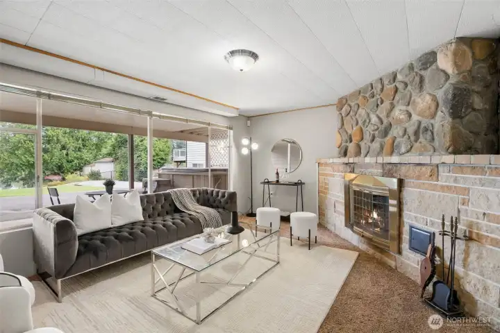 Lower level living space with wood burning fireplace.