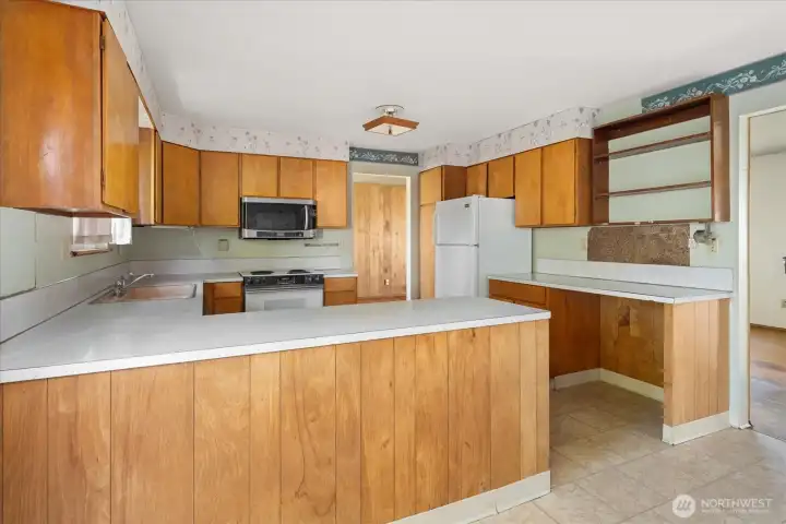 Main home kitchen with tons of storage and workspace