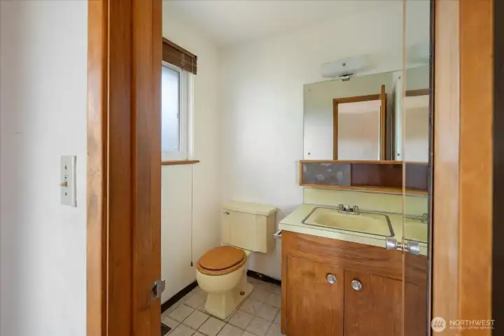 Ensuite bathroom with sink and toilet in main home