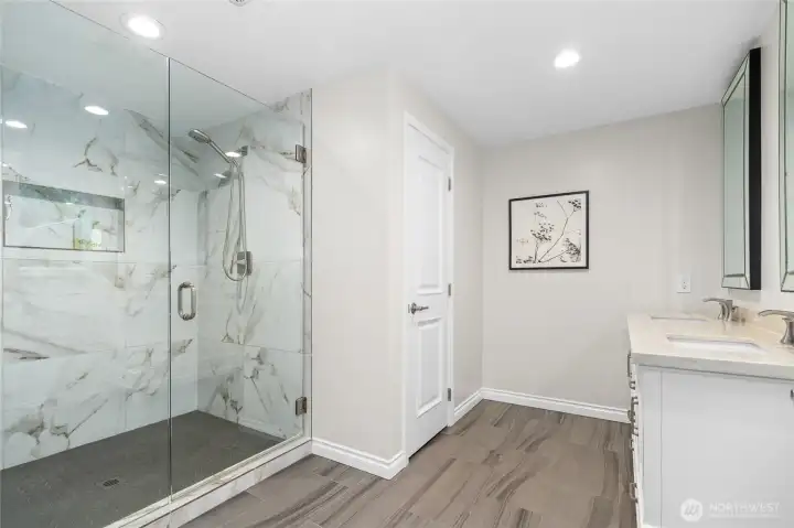Owner Suite with huge walk-in closet, windows to backyard, en-suite bathroom with 2 sinks and large glass shower!