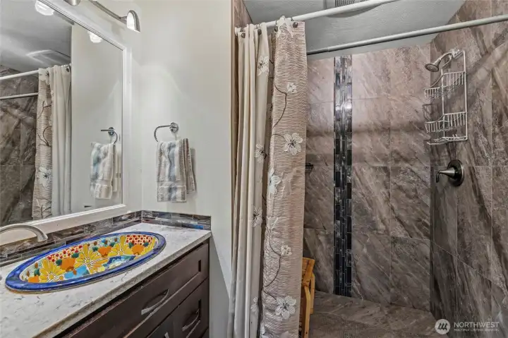 3/4 hall bathroom with walk-in tile shower