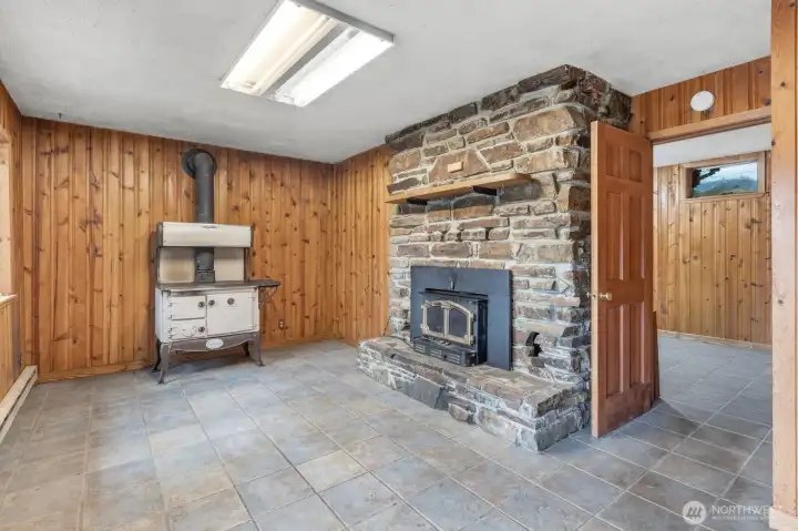Beautiful stone fireplace with wood burning insert.