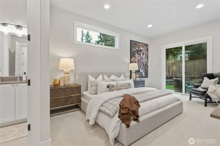 A generous main floor guest suite complete with 3/4 bath and private patio