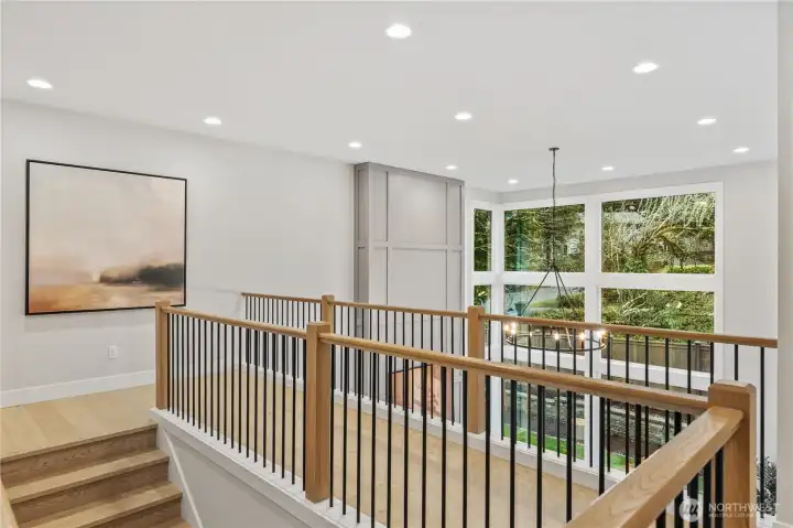 Open rail catwalk overlooks the family room