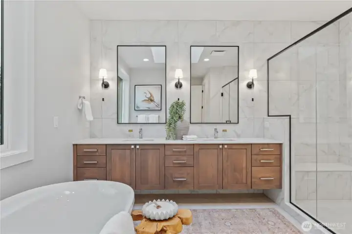 A spa-inspired bath featuring a floating vanity, freestanding soaking tub and oversized walk-in shower