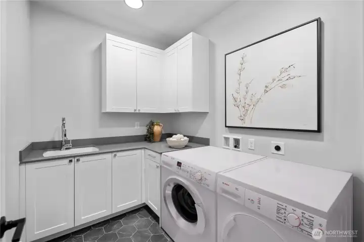 Upper level utility room with full size washer and dryer