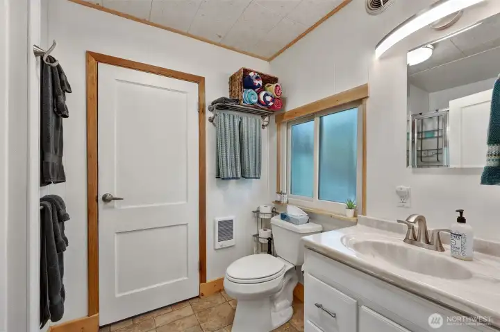 3/4 Bathroom on Main Floor Connects Kitchen and Bedroom