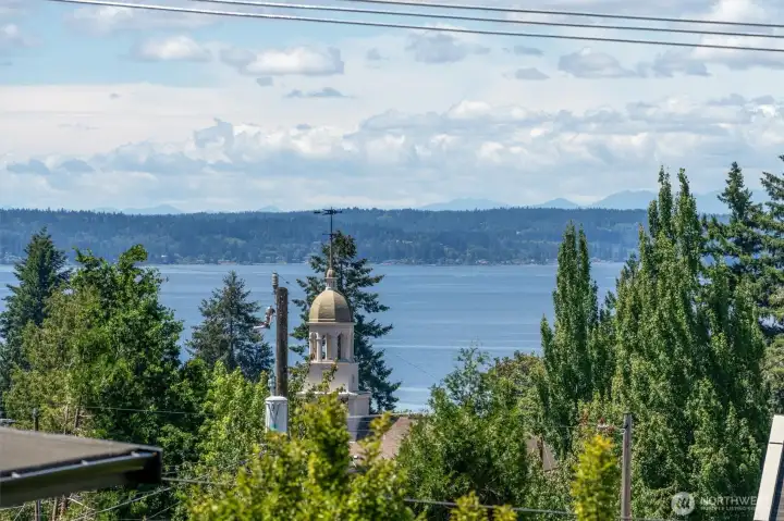 Enjoy scenic Puget Sound, island, mountain, and territorial views from inside the home and from its inviting outdoor spaces. Enjoy scenic Puget Sound, island, mountain, and territorial views from inside the home and from its inviting outdoor spaces.