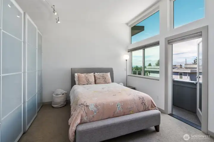 The primary suite is a private retreat featuring beautiful views, a step-out balcony, high & vaulted ceilings, multiple closets with custom built-in shelving, special lighting, and en suite bath. The primary suite is a private retreat featuring beautiful views, a step-out balcony, high & vaulted ceilings, multiple closets with custom built-in shelving, special lighting, and en suite bath.