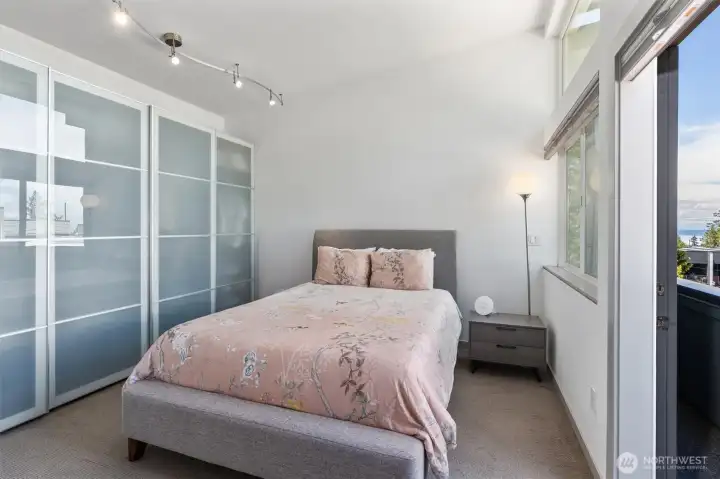 The primary suite is a private retreat featuring beautiful views, a step-out balcony, high & vaulted ceilings, multiple closets with custom built-in shelving, special lighting, and en suite bath. The primary suite is a private retreat featuring beautiful views, a step-out balcony, high & vaulted ceilings, multiple closets with custom built-in shelving, special lighting, and en suite bath.
