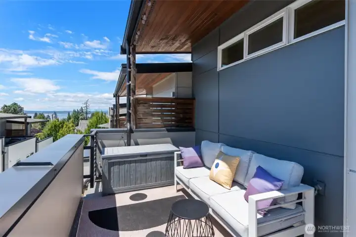 Covered deck with amazing Puget Sound, mountain, and territorial views for year-round enjoyment. Covered deck with amazing Puget Sound, mountain, and territorial views for year-round enjoyment.
