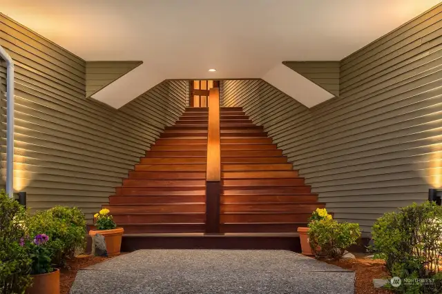 Dramatic entry staircase was resurfaced with Brazilian Ipe hardwoods and is enhanced with the lighting design.
