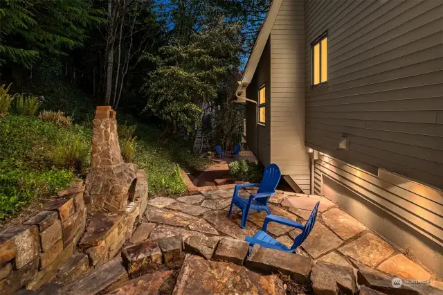 The flagstone patio features a stone oven. Outdoor lighting allows you to enjoy in the evening.