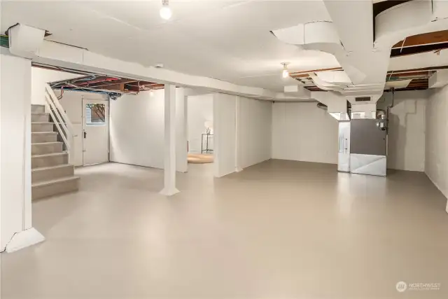 This wide open basement is ready for the imagination and is easily accessed by the interior stairwell. The door to the left provides convenient access to the backyard and garage.
