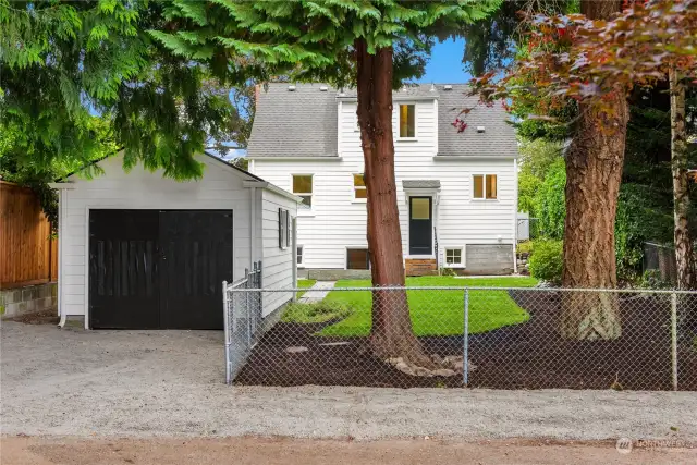 Ample off street parking in front of the garage and along the fence off of Beveridge Pl.
