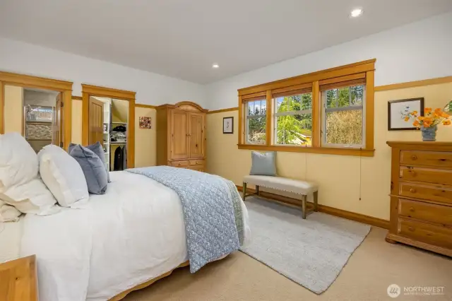 Another look at the primary bedroom. One of two closets can be seen, and the door to the primary bath.