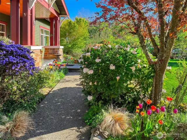 Colorful landscaping welcomes you to the front porch.