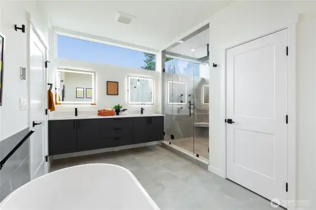 Large primary shower with dual jets + free standing soaking tub.