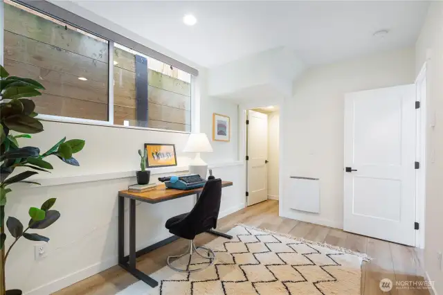 The second bedroom on the first level is currently staged as an office.