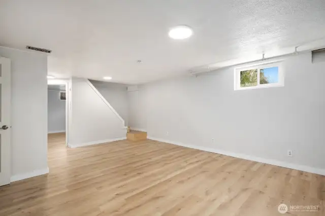 Lower level receoom/living room. New metal railings are on there way and will be installed prior to closing.