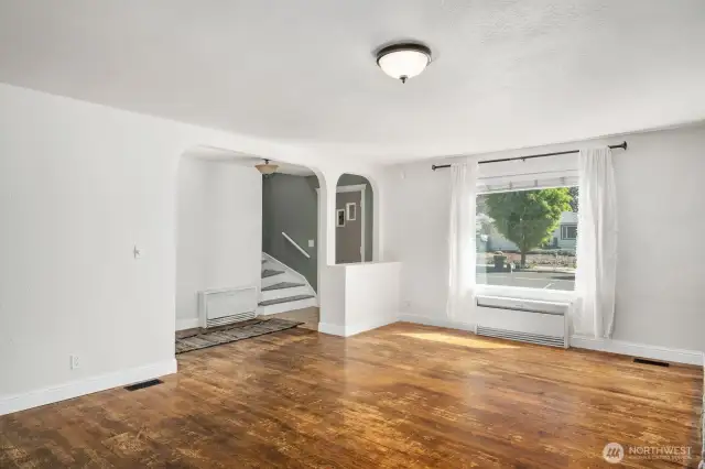 Formal entry leads to large living room with oak floors.