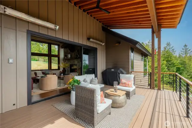 Deck off great room with dual 220V heaters and a fan.
