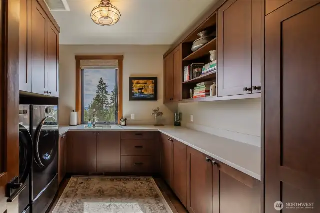 Main floor utility room is just off mud room between garage and entry,