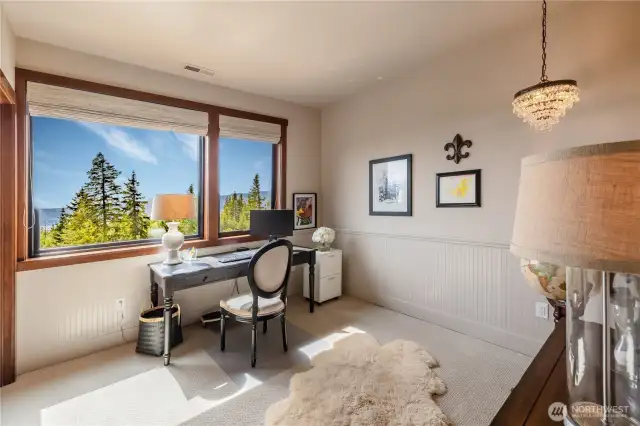 upper floor bedroom is nicely appointed to take in views.