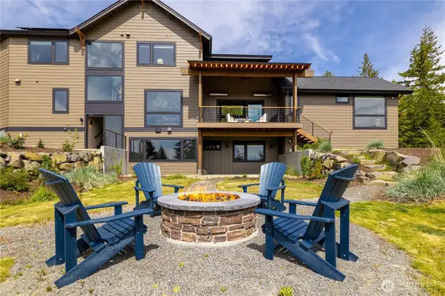 Grounds include plumbed firepit, garden shed, beautiful landscaping, + electrical & pad ready for your hot tub.