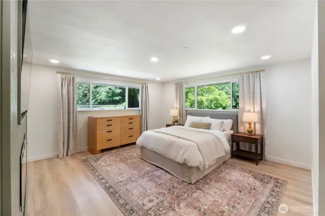Relaxing primary bedroom with recessed lighting. Don't miss the updated windows throughout.