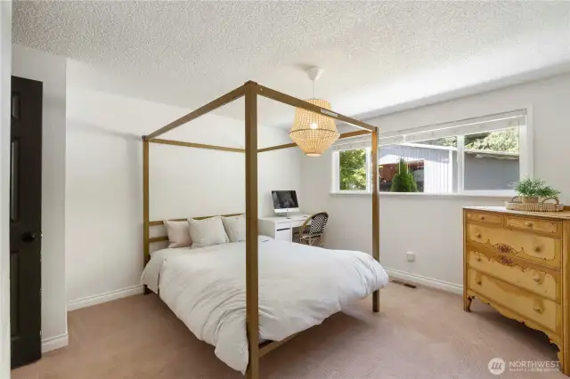 Guest bedroom #3. Home offers heat pump with air conditioning to save money and keep you comfortable all year long. It's also wired for a generator.