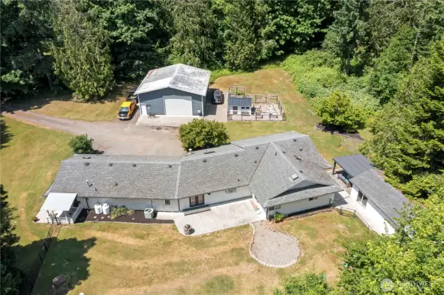 It also offers a custom chicken coop, garden with raised beds, and a detached bonus room.