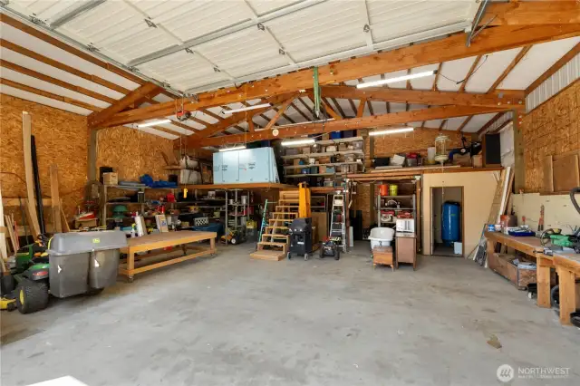 Shop offers 220v power and work benches. Room with water filtration & softener on the right.
