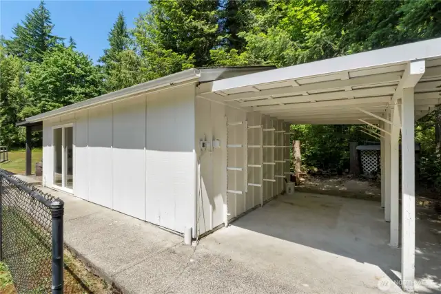 Lean to off the bonus room on the right and covered patio on the left.