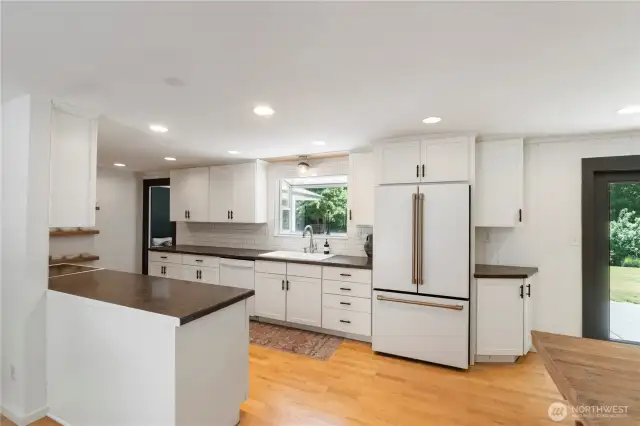 Beautiful kitchen with modern cabinets and stylish tile backsplash.