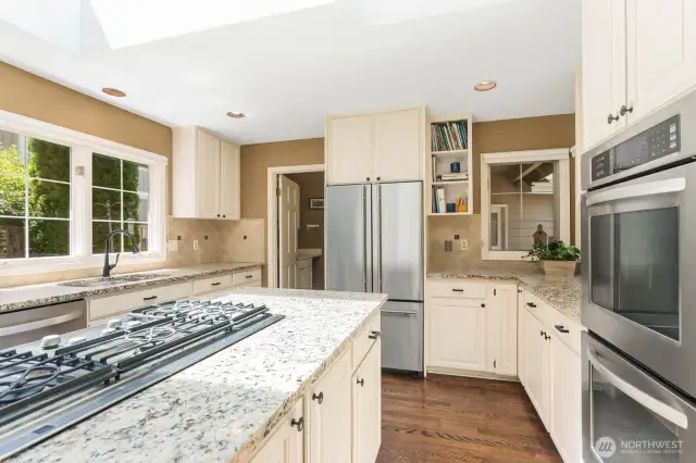 Notice the back of the kitchen with a doorway that leads to...