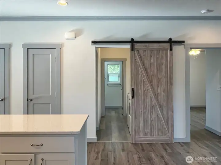 Entry with view of the Laundry/Mud room   and access to quest bathroom and front   bedroom