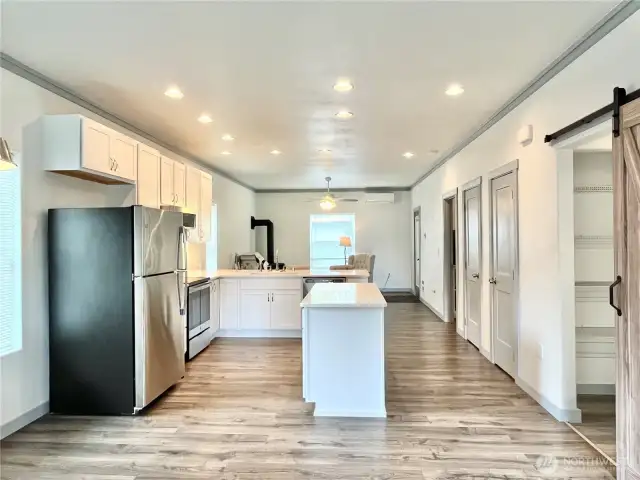 Open Design and Doors to the Patio, Primary Bedroom, Pantry, Laundry and 2nd Bedroom to the right