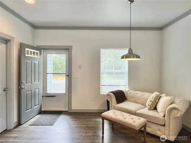 Elegantly painted Trim, doors compliment laminate flooring throughout