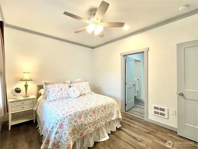 View of Primary Suite and door to the full bathroom and walk in closet.