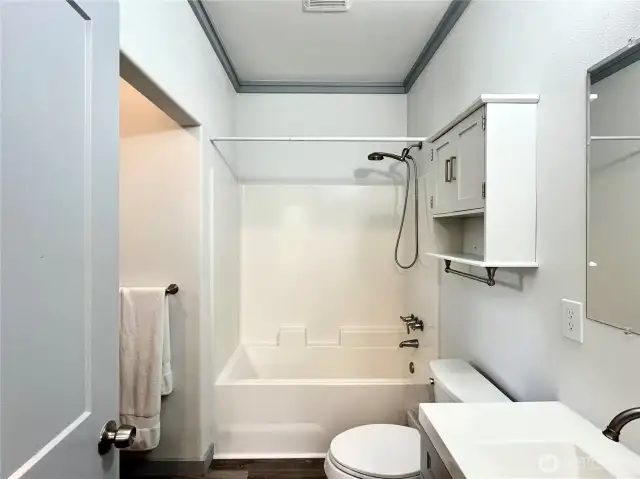 Primary Bedroom Bathroom with Soaking Tub and access to walk-in clostet
