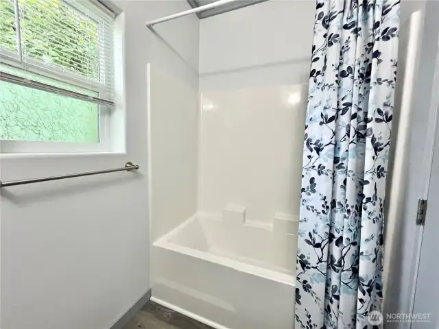 Guest Bathroom has a full tub.