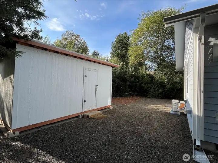 Behind the home is a private oasis with