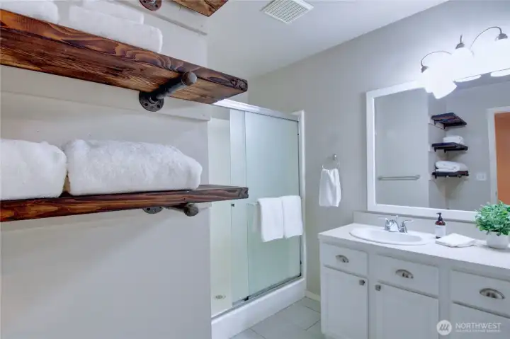 Primary bathroom with large walk-in shower.