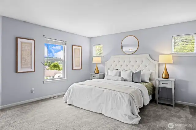 main suite with fireplace and sitting area