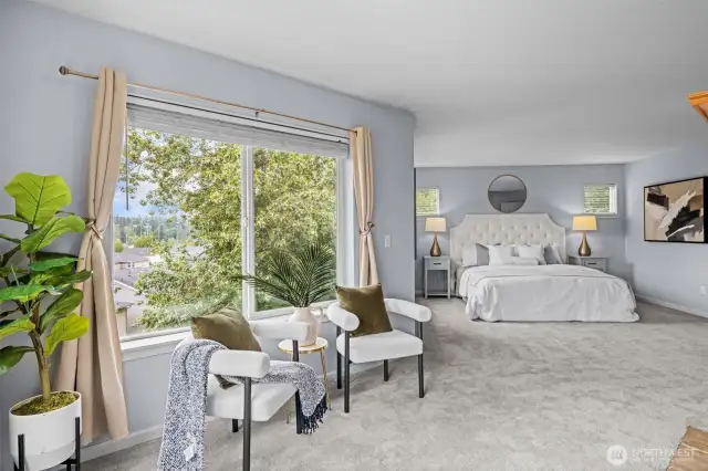 main suite with fireplace and sitting area