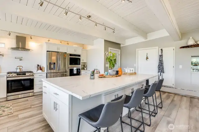 Huge 5' x 10' eating island in the kitchen with seating for 6