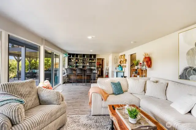 Family room looking South towards bar and outside patio areas