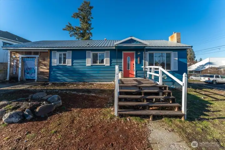 Freshly repainted exterior in 2024 with durable metal roof installed in 2023.