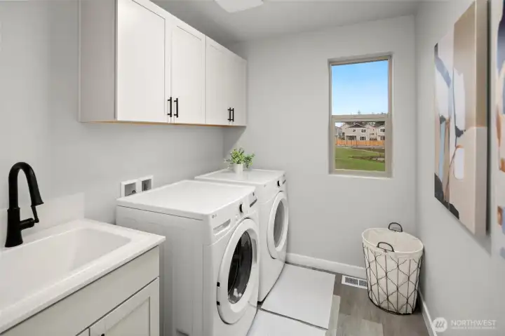 Laundry room w/ sink option.
